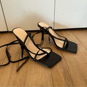 Strappy black heels with square toe